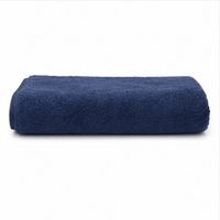 Folded navy blue towel on a white background