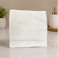 White towel on a bathroom counter with a neutral background