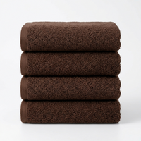 Four folded brown towels stacked vertically on a clean white background.